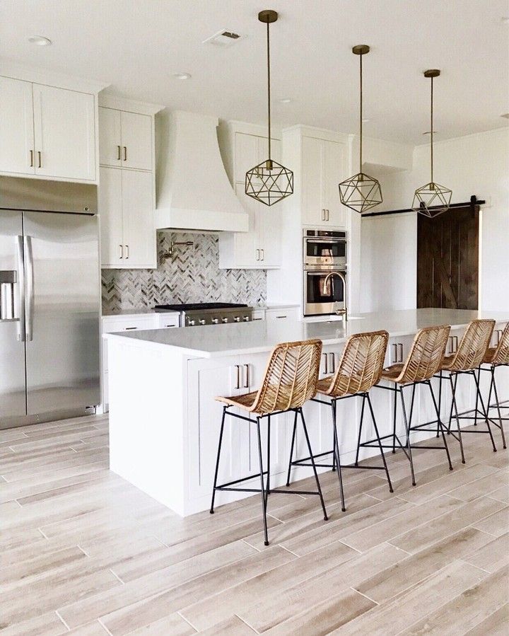 LIKEtoKNOW.it on Instagram: “Opt for wicker bar stools and deco light fixtures for a boho chic twist on your classic kitchen decor care of @thesisterstudioig | Follow…”