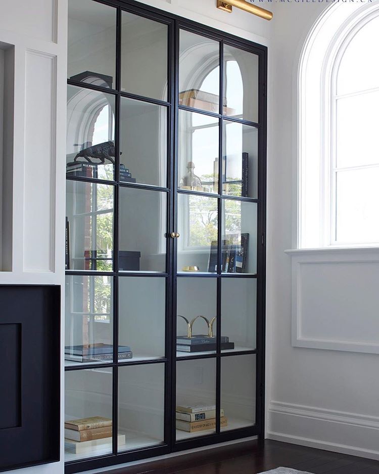 McGill Design Group Inc on Instagram: “Display your books and treasures in a stylish setting by installing built-ins with elegant glass doors like we did here in a client’s Media…”