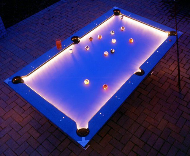 Outdoor Pool Table Features Built-In Lighting For Nighttime Play