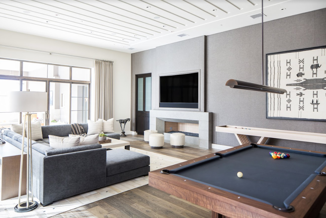 Soft neutrals in a coastal inspired game room and lounge space.