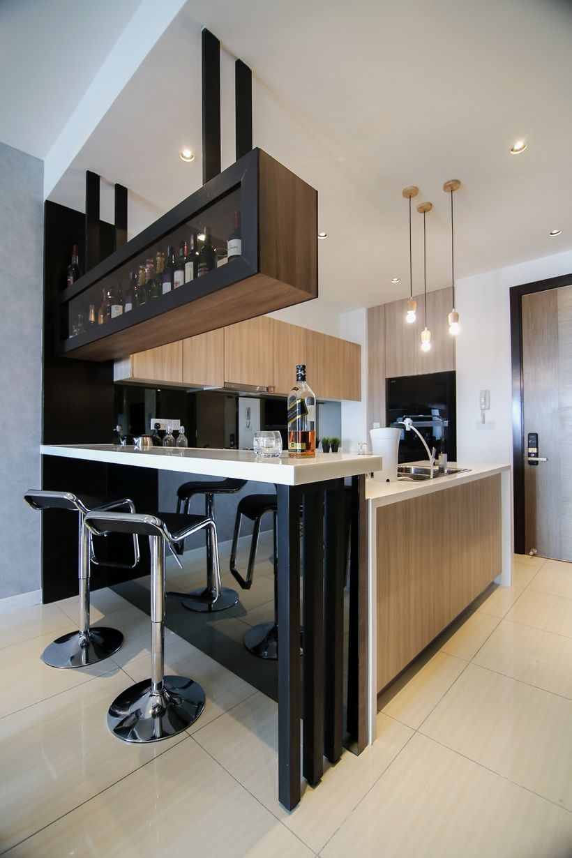 Stylish kitchen with integrated bar counter.