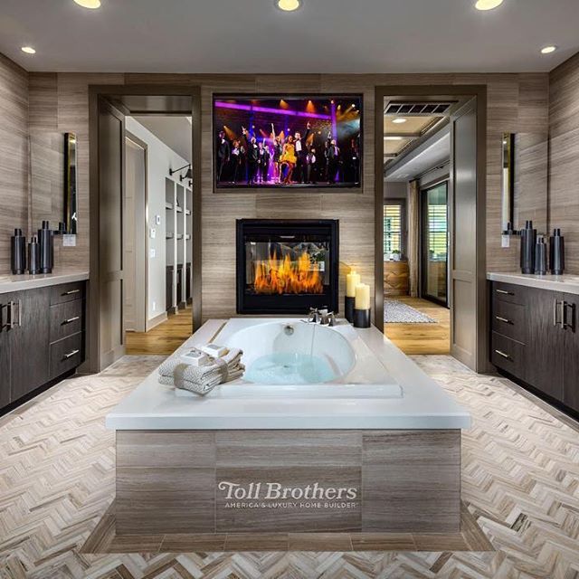 Toll Brothers on Instagram: “Today’s #BestofToll photo, from our Alpine model home in #CA, is a #luxurious master bath with a standalone tub, a fireplace, and a TV is…”