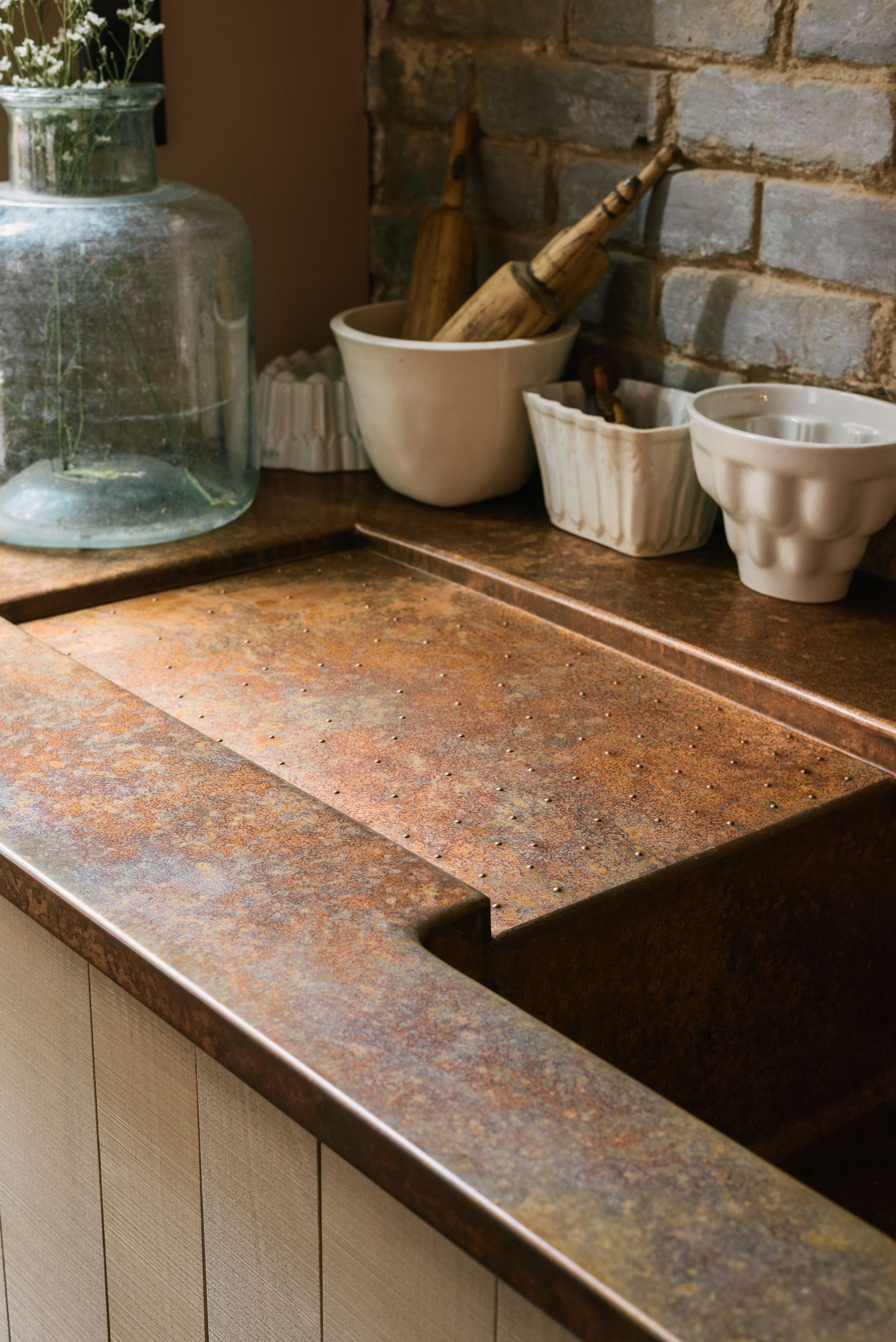 We went for one of our hand-aged copper worktops for the Sebastian Cox Potting S...