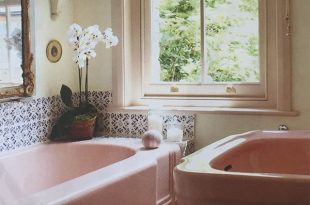 Pink bathroom suite with blue & white tiles from @houseandgardenuk .