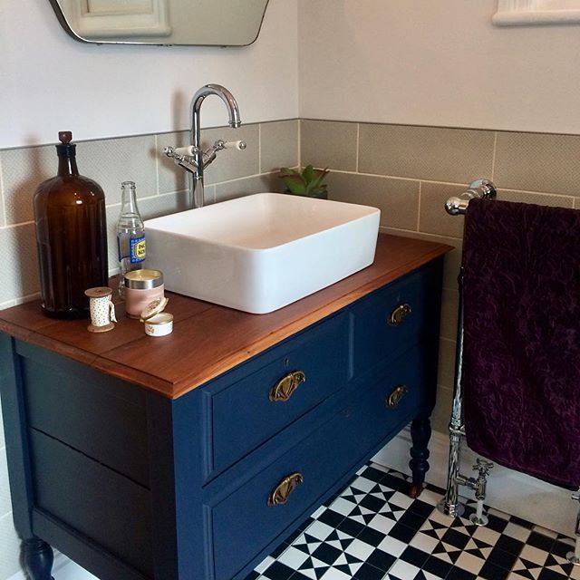 Bathroom vanity unit, monochrome floor tiles, blue vanity unit .