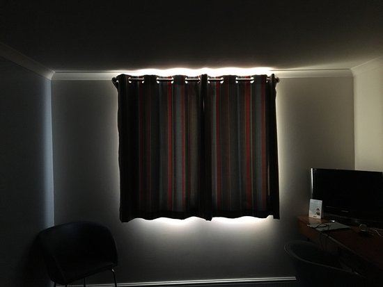 Blackout curtains let light in all around - Picture of Travelodge .