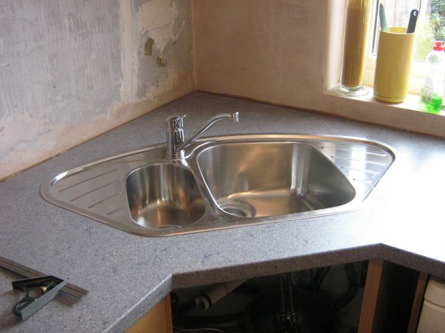 stainless steel corner kitchen sink, but in an over mount design .